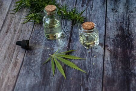 Cannabis herb and leaves for treatment with decoction, tincture, extract, oil. Hemp oil. Selective focus.の写真素材