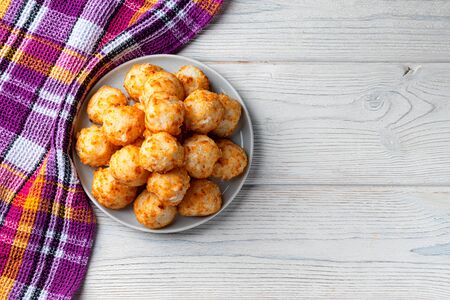 Energy balls with coconut and nuts on a white plate, Homemade wholesome food. Diet. View from aboveの写真素材
