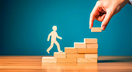 The path to the goal: a businessman climbs the stepsの素材