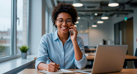 A smile on the phone: a productive call from the modern officeの素材