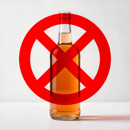 Bottle of alcohol displayed with a bold red prohibition sign, emphasizing the dangers of alcoholism and promoting awareness of its harmful effects on individuals and communitiesの素材