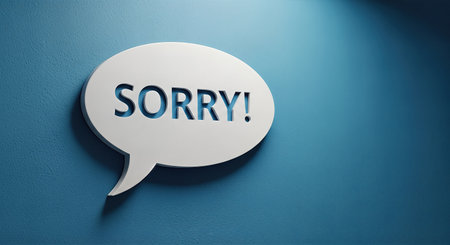 Speech bubble featuring the word "Sorry!" against a blue textured wall, symbolizing apology and forgiveness, creating a contemporary and artistic atmosphereの素材