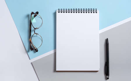 Real photo, stationery branding mockup notepad template to place your design, isolated on light gray blue background. Modern Stylish male business, graphic summer office supplies.の写真素材