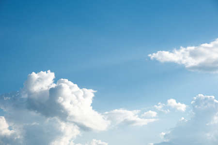 White clouds in the blue sky.