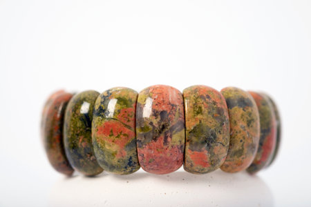 Natural unakite stone bracelet on white background. Unisex. Isoteric.の写真素材