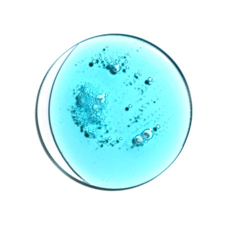 Texture swatch of blue hyaluronic acid serum gel on white isolated background, macro. Detergent, cosmetics, laboratory. A round drop in a petri dishの写真素材