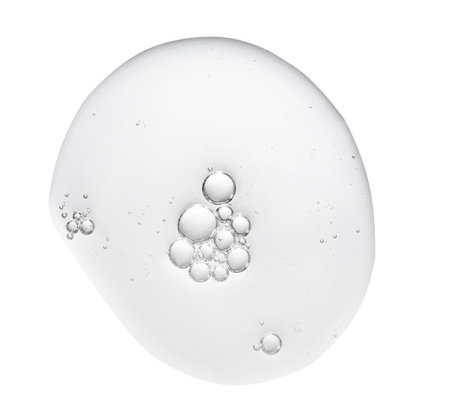 Texture swatch of glycerin gel transparent hyaluronic acid serum on white isolated background, macro. Detergent, cosmetics, laboratory. A round dropの写真素材