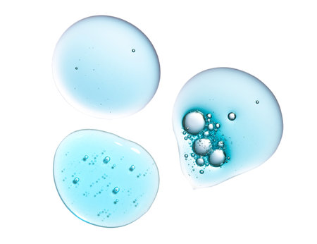 Texture swatch of blue hyaluronic acid serum gel on white isolated background, macro. Detergent, cosmetics, laboratory. A round drop in a petri dishの写真素材