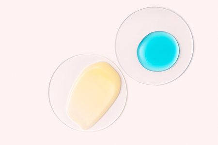 Face care washing cleansing with foam and hydrophilic oil, hyaluronic acid serum, retinol cream cosmetics on a beige background flat layの写真素材