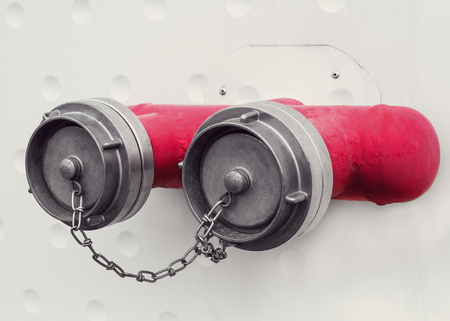 Fire hydrant on a white wallの写真素材