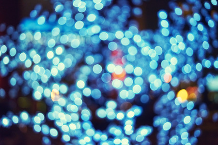 Blurred texture Christmas decorations with bright lights. Beautiful light bulbs for Christmas. Basic background for designの写真素材
