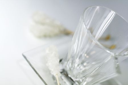 empty glass cup, plate and caramel sugarの写真素材