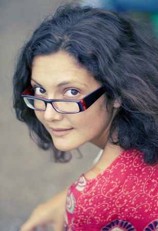 pretty brunet woman in glasses and red dress