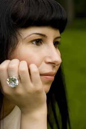 closeup portrait of young brunette in the parkの写真素材