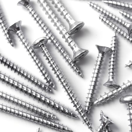 metal screws closeup on white backgroundの写真素材