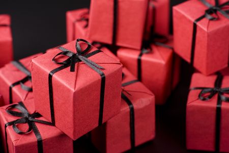 many red gift boxes on black backgroundの写真素材