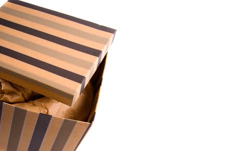opened gift box with craft paper inside closeup