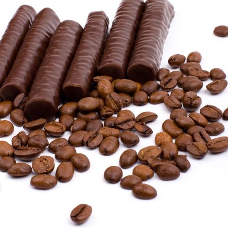 chocolate bars and coffee beans on white backgroundの写真素材