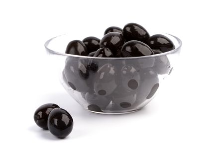 bowl of black olives isolated on white backgroundの写真素材