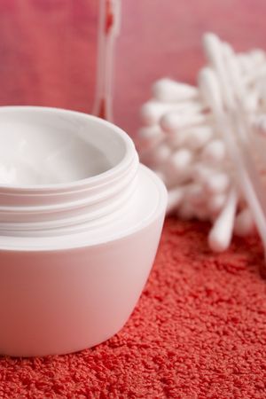 closeup of facial cream and cotton pads - cosmeticsの写真素材