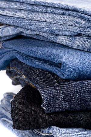 stack of blue jeans closeupの写真素材
