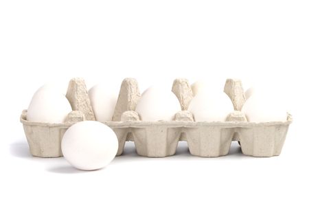 chicken eggs in packing isolated on white backgroundの写真素材