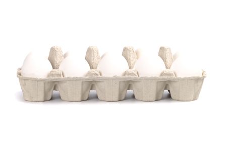 chicken eggs in packing isolated on white backgroundの写真素材