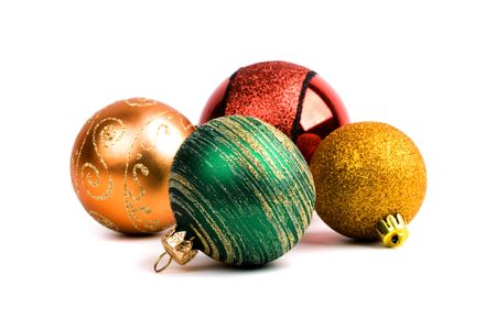 four glass christmas balls isolated on white backgroundの写真素材