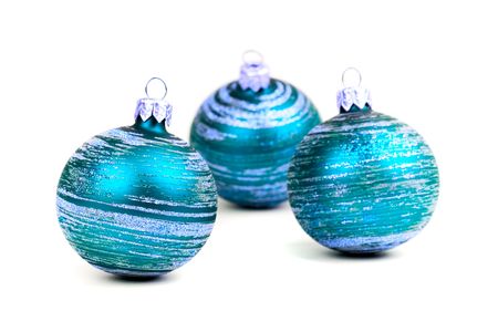 three blue christmas balls isolated on white backgroundの写真素材