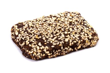 chocolate cookie with sesame seeds isolated on white backgroundの写真素材