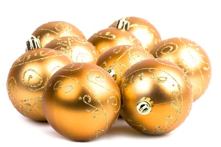 golden glass christmas balls closeup on white backgroundの写真素材