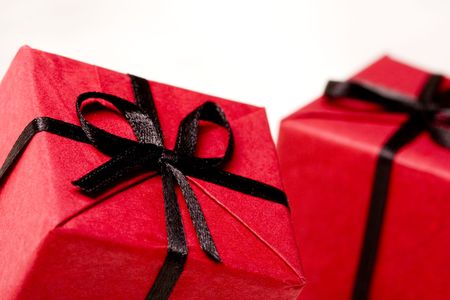 red gift boxes closeup on white background の写真素材