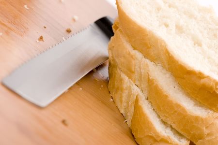 macro image of baguette and knife closeup