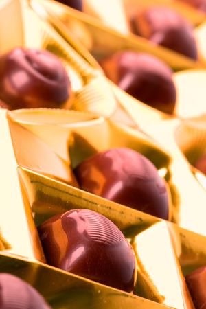 chocolate sweets in golden box closeupの写真素材