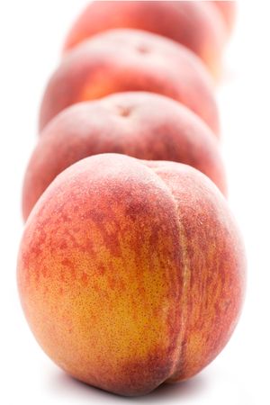 four peaches on white backgroundの写真素材