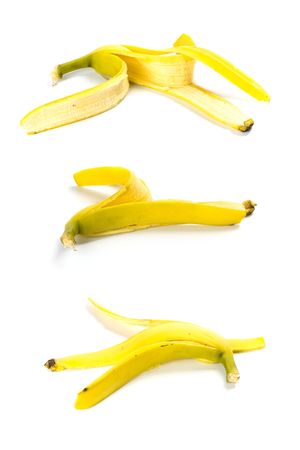 three banana peels isolated on white backgroundの写真素材