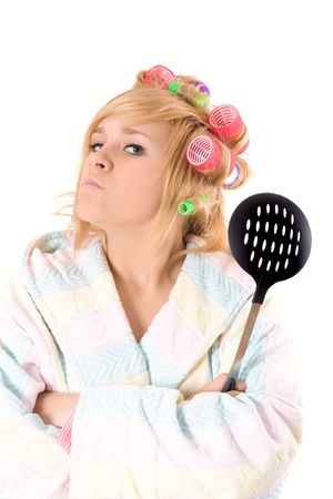 portrait of funny housewife with curlers and skimmer isolated on white backgroundの写真素材