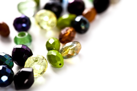 clorful glass beads closeup on white backgroundの写真素材