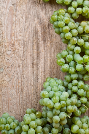  fresh green grapes on wooden background with copyspace の写真素材