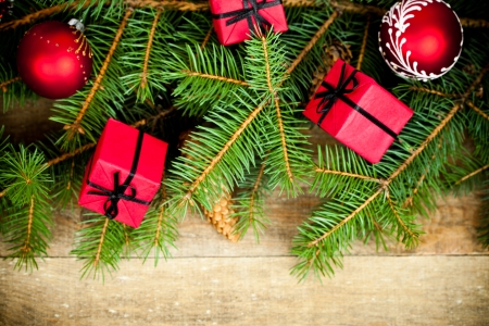christmas fir tree with decoration on a wooden boardの写真素材