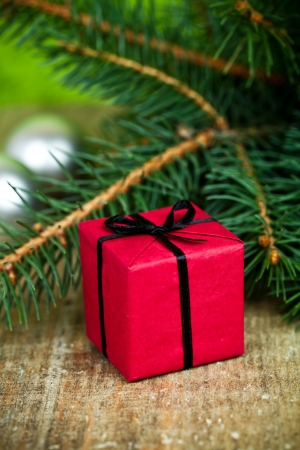 christmas decorations and fir tree on a wooden boardの写真素材