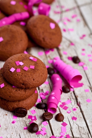 fresh chocolate cookies, coffee beans, pink ribbons and confetti の写真素材