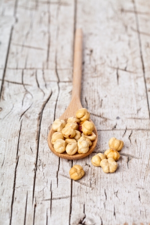 hazelnuts in wooden spoonの写真素材
