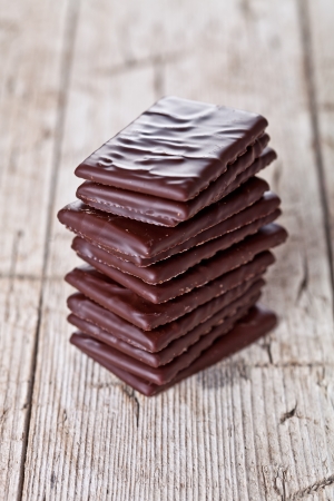 chocolate sweets on rustic wooden background の写真素材