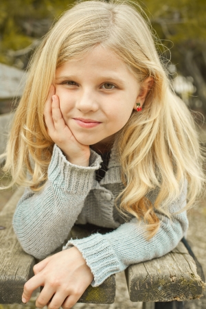portrait of pretty girl on a bench の写真素材