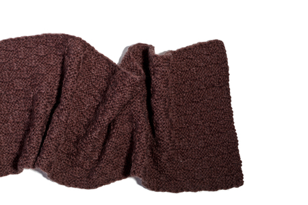 knitted brown scarf isolated on white backgroundの写真素材
