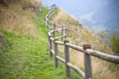 Autumn nature concept. Italian landscape, hills and wooden handrails.の写真素材