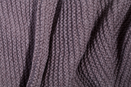 Knitted brown scarf texture background.