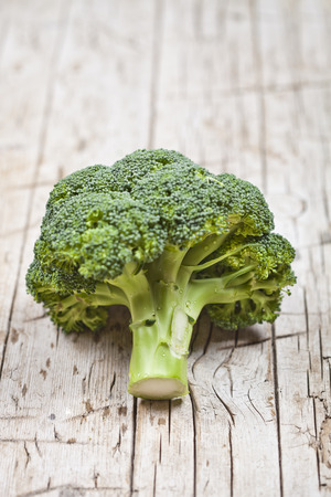Fresh green organic broccoli on wooden rustic background.の写真素材
