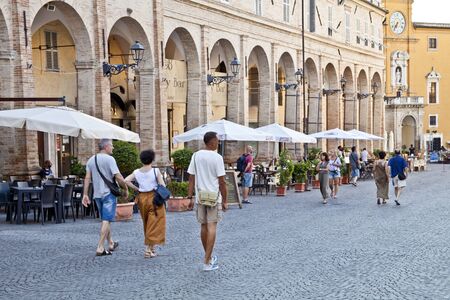 Fermo, Italy - June 23, 2019: People enjoying summer day and food at outdoor restaurant and resting, Piazza del Popolo, Fermo, Italyのeditorial素材